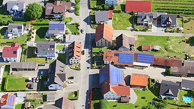 Houses in a village with solar panels